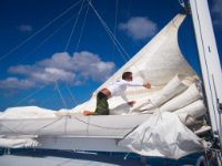 Martin stowing the main sail as we motor into Rendevous Bay.